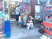 Beijing Village Family in Front of Their Store