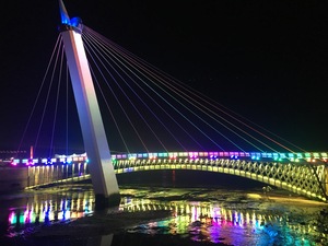 Qingdao at night harbor bridge